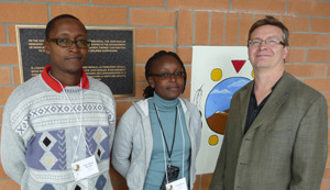 UofM Bulletin pic during the 2010 Symposia Meet & Greet, April 26, 10. Trainees Peter Maturi Mwamba and Cisily Meeme, with Dr. Keith Fowke, Principal Investigator.